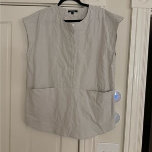 Sleeveless Kal Rieman shirt.
